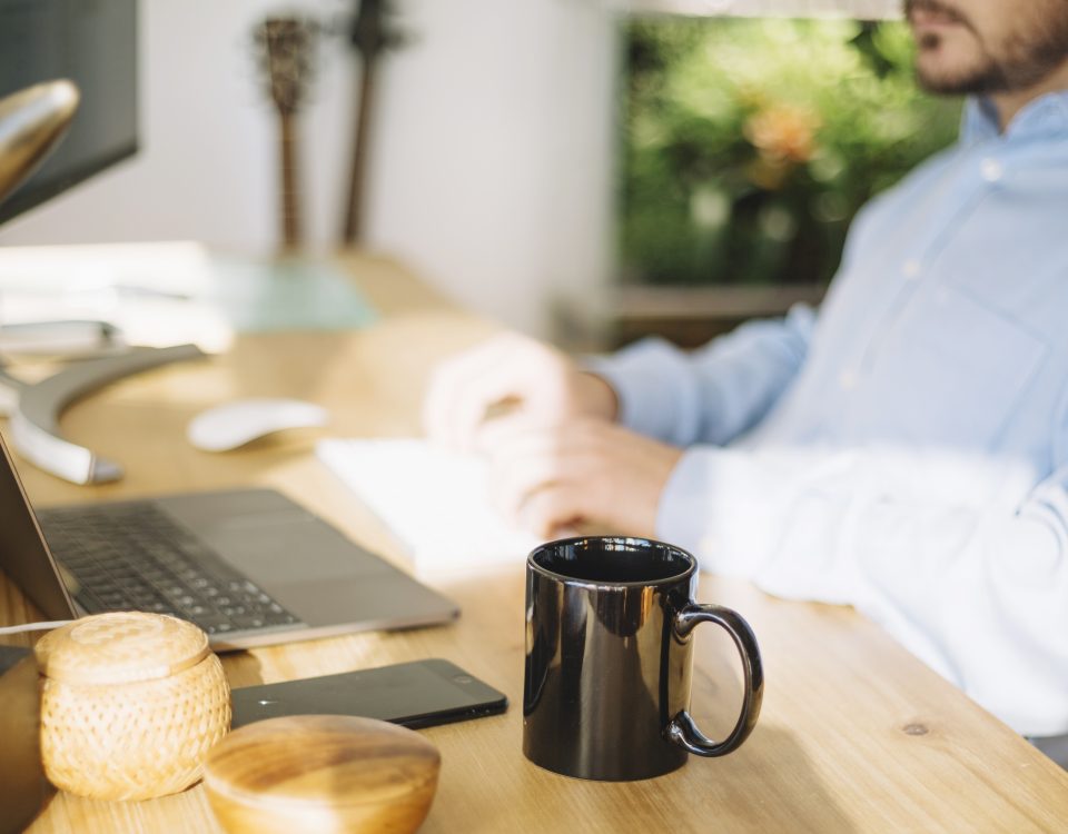 mug-standing-near-working-man